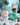 White and cracked turquoise Teddy LuLu figures displayed with turquoise stones