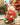 LuLu delivery rider figure on a red and mint-green scooter