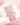 Pale pink translucent Teddy LuLu figure posed on a pink crystal
