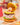LuLu burger figure with yellow bun lid open to reveal Mimi