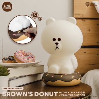 LINE FRIENDS BROWN sitting on a chocolate-sprinkle donut coin bank with an inset showing a coin entering the slot