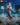 Blokees Legend Edition Ultraman Suit Ver.7 model posed with sword against a city skyline