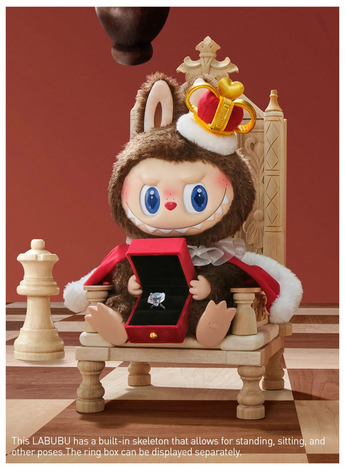 Labubu Let’s Checkmate vinyl plush seated on a chess throne holding an open red ring box
