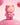 Fuzzy pink Teddy LuLu figure against a soft pink background