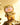 Gold metallic Teddy LuLu Ore Collection figure standing on a mineral rock