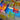 Loose translucent Newton's Tower blocks casting overlapping rainbow light and shadows